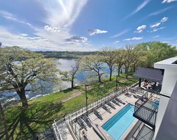 a balcony with a pool and a view of a river